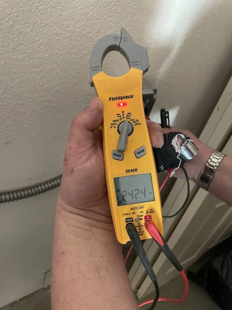Voltage testing with clamp meter during Aluminum Wiring Replacement in Pierson